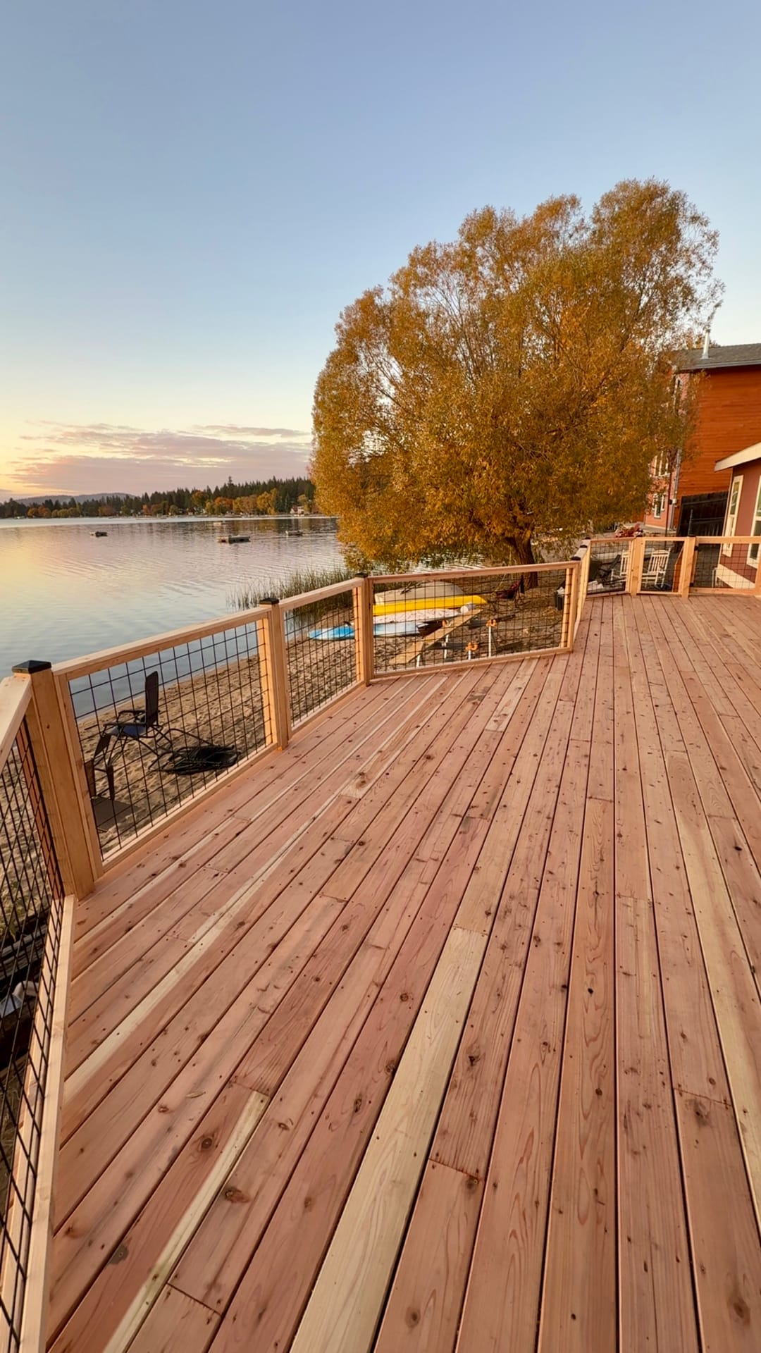 Cedar deck overlooking the lake at sunset
